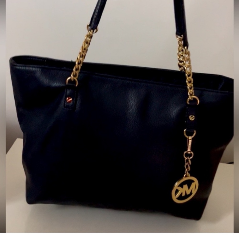 Michael Kors Black Tote with Gold Accents with lots of compartments